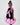 Girl in black velvet dress with pink organza ruffles and voluminous skirt.