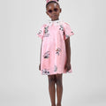 Girl in pink A-line dress with panda print and lace collar.