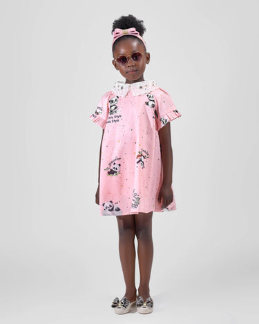 Girl in pink A-line dress with panda print and lace collar.
