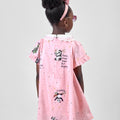 Girl in pink A-line dress with panda print and lace collar.