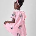 Girl in pink A-line dress with panda print and lace collar.
