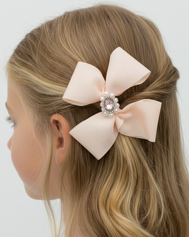 Blonde hair with a large pink bow accessory on a white background