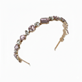 Headband with pink gemstones on a white background