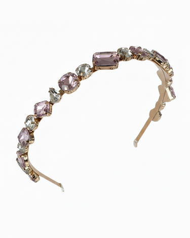 Headband with pink gemstones on a white background