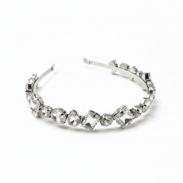 Silver headband with clear gemstones on a white background